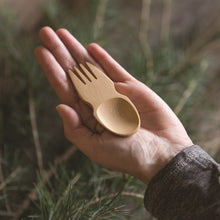 Load image into Gallery viewer, Hand holding a wooden fork and spoon against a natural background | Little Twidlets
