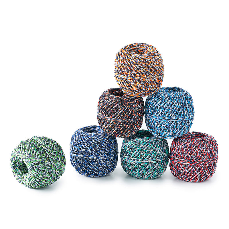 Colorful yarn balls stacked on a white background