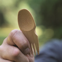 Load image into Gallery viewer, Hand holding a wooden spork against a blurred natural background | Little Twidlets 
